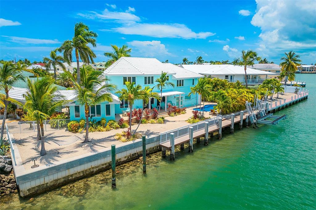770 9th Street Key Colony Beach, FL 33051 - Photo 37 of 39 a view of swimming pool with outdoor seating