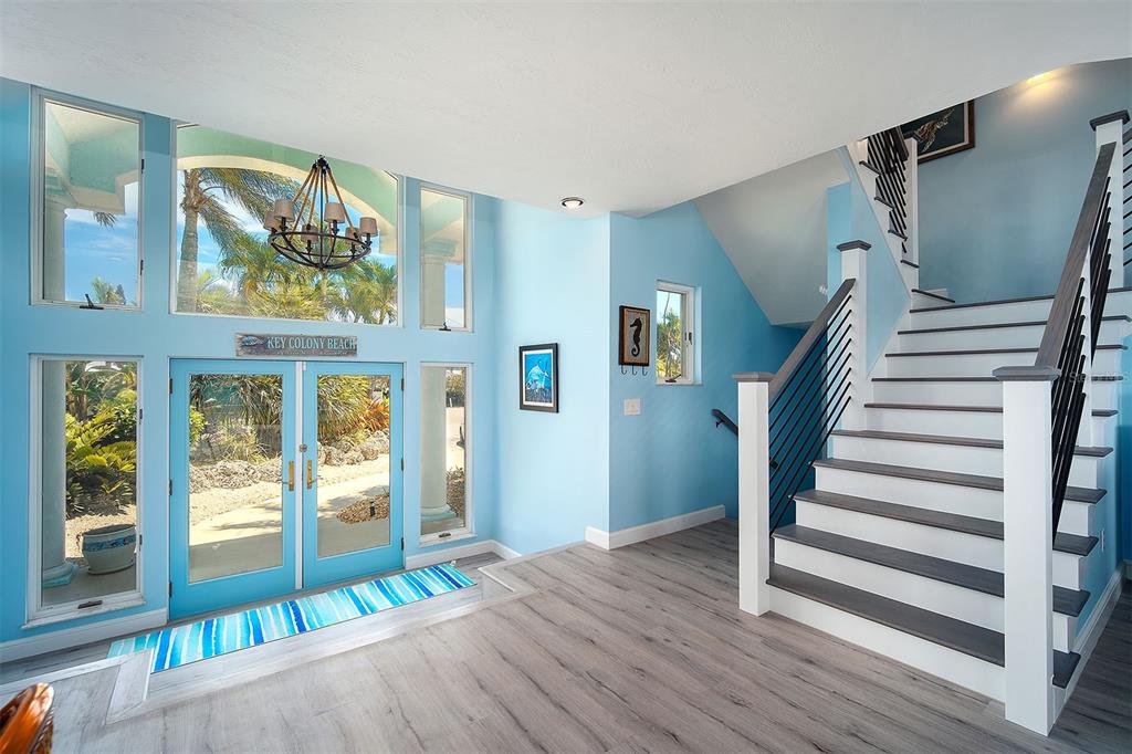770 9th Street Key Colony Beach, FL 33051 - Photo 5 of 39 a view of entryway with wooden floor and windows