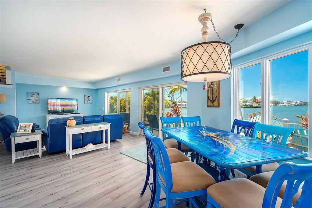 770 9th Street Key Colony Beach, FL 33051 - Photo 7 of 39 a view of a dining room with furniture window and wooden floor