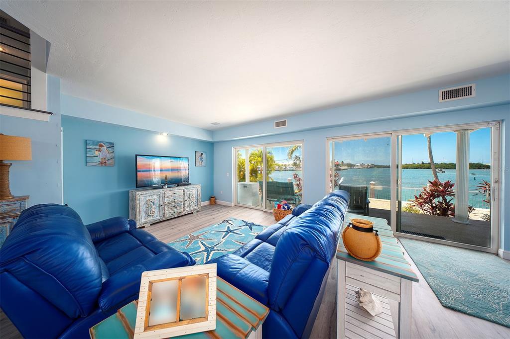 770 9th Street Key Colony Beach, FL 33051 - Photo 9 of 39 a living room with furniture and a flat screen tv