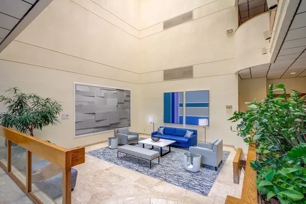 a outdoor space with patio the couches and a potted plant on the wall