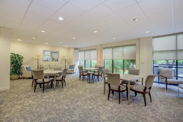 a view of a dining area with furniture window and outside view