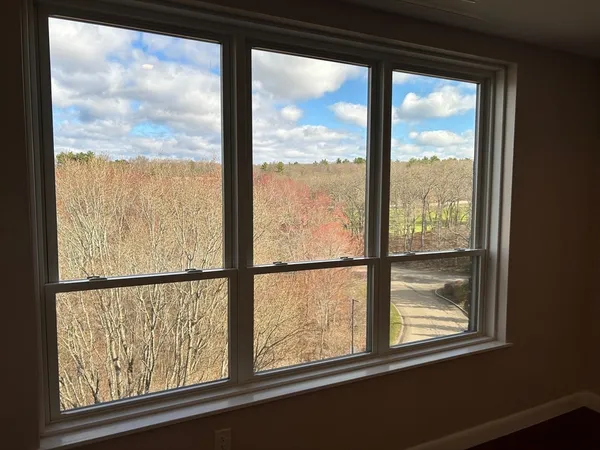 a view of an empty room with a large window
