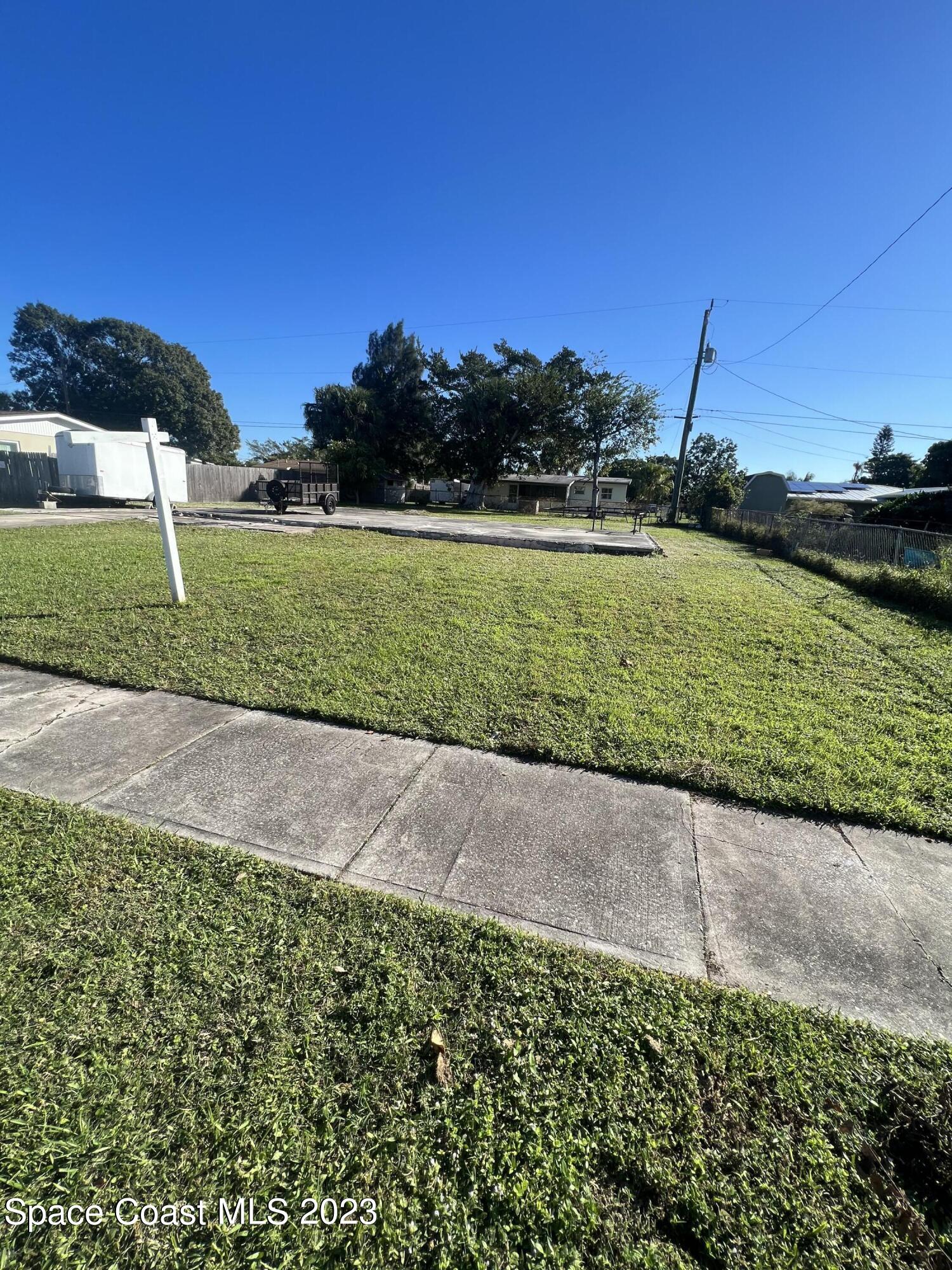 a view of a garden with an ocean