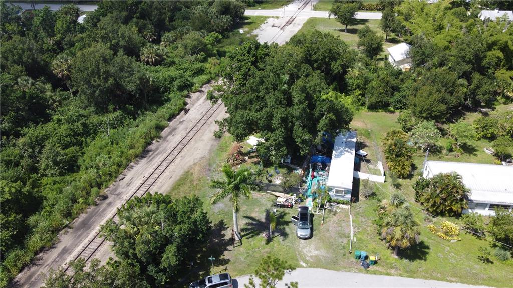 1605 Griffith Avenue Punta Gorda, FL 33982 - Photo 1 of 4 an aerial view of residential house with outdoor space and trees all around