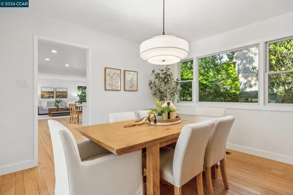 a kitchen with stainless steel appliances a stove a sink a refrigerator and cabinets