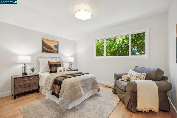 a bedroom with a bed and a table in it