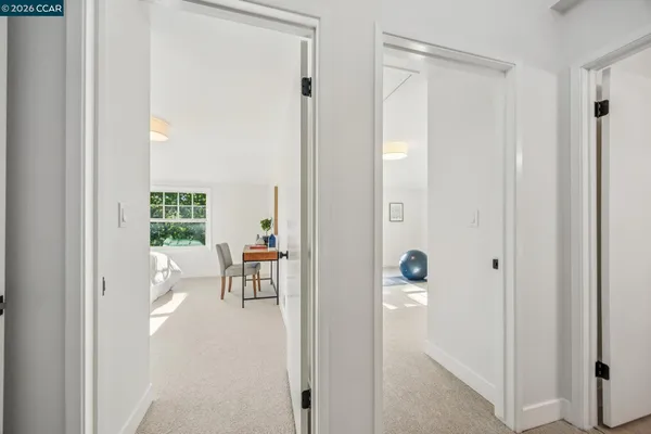 a bedroom with a bed and a table