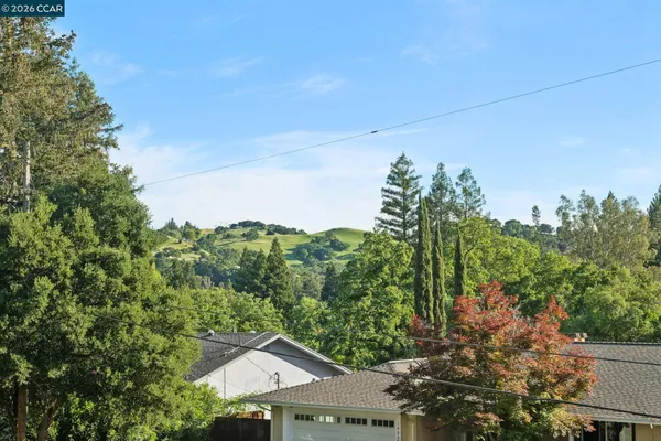 a view of entryway and hall with a chair