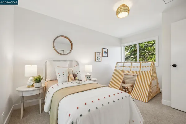 a bathroom with a granite countertop toilet sink and mirror