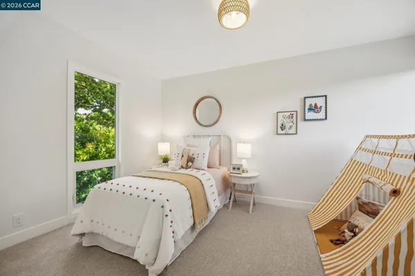 an outdoor sitting area with furniture and wooden floor
