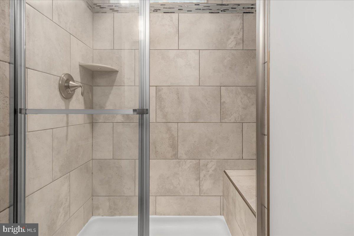 521 East 7th Street Frederick, MD 21701 - Photo 18 of 44 Primary Shower w/ Transom Window & Built in Bench