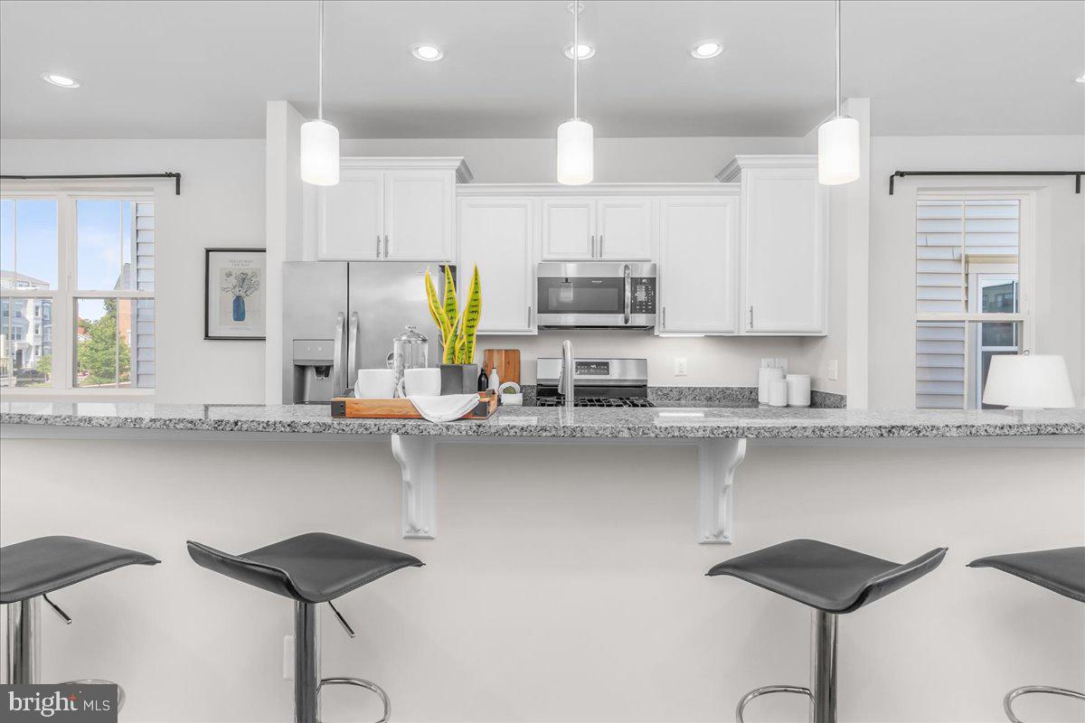 521 East 7th Street Frederick, MD 21701 - Photo 9 of 44 Pendant Lighting Complimenting the Large Island