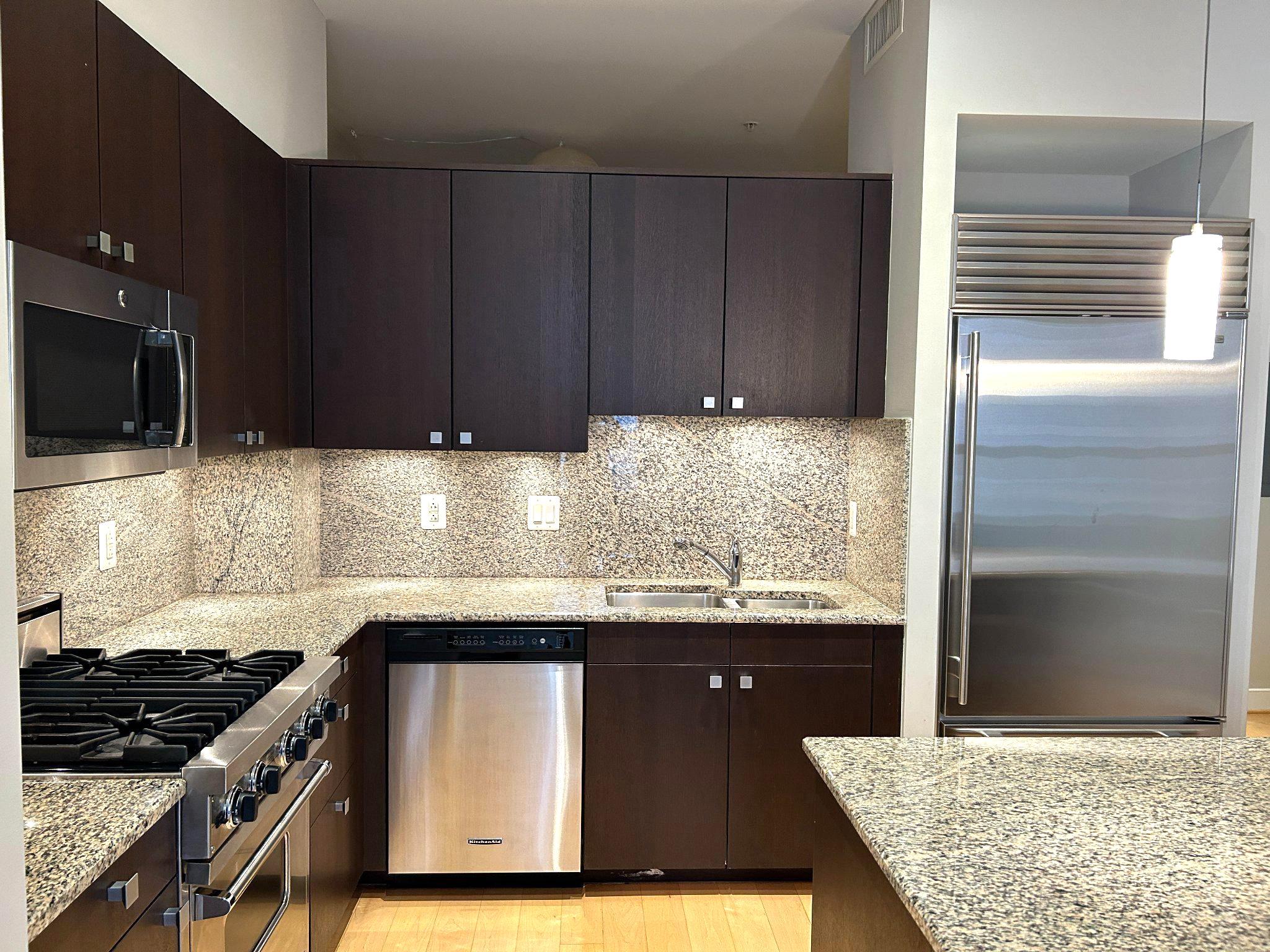 2425 L Street Northwest, Unit 421 Washington, DC 20037 - Photo 8 of 18 Elegant countertops and appliances