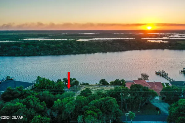 a view of a lake with a yard