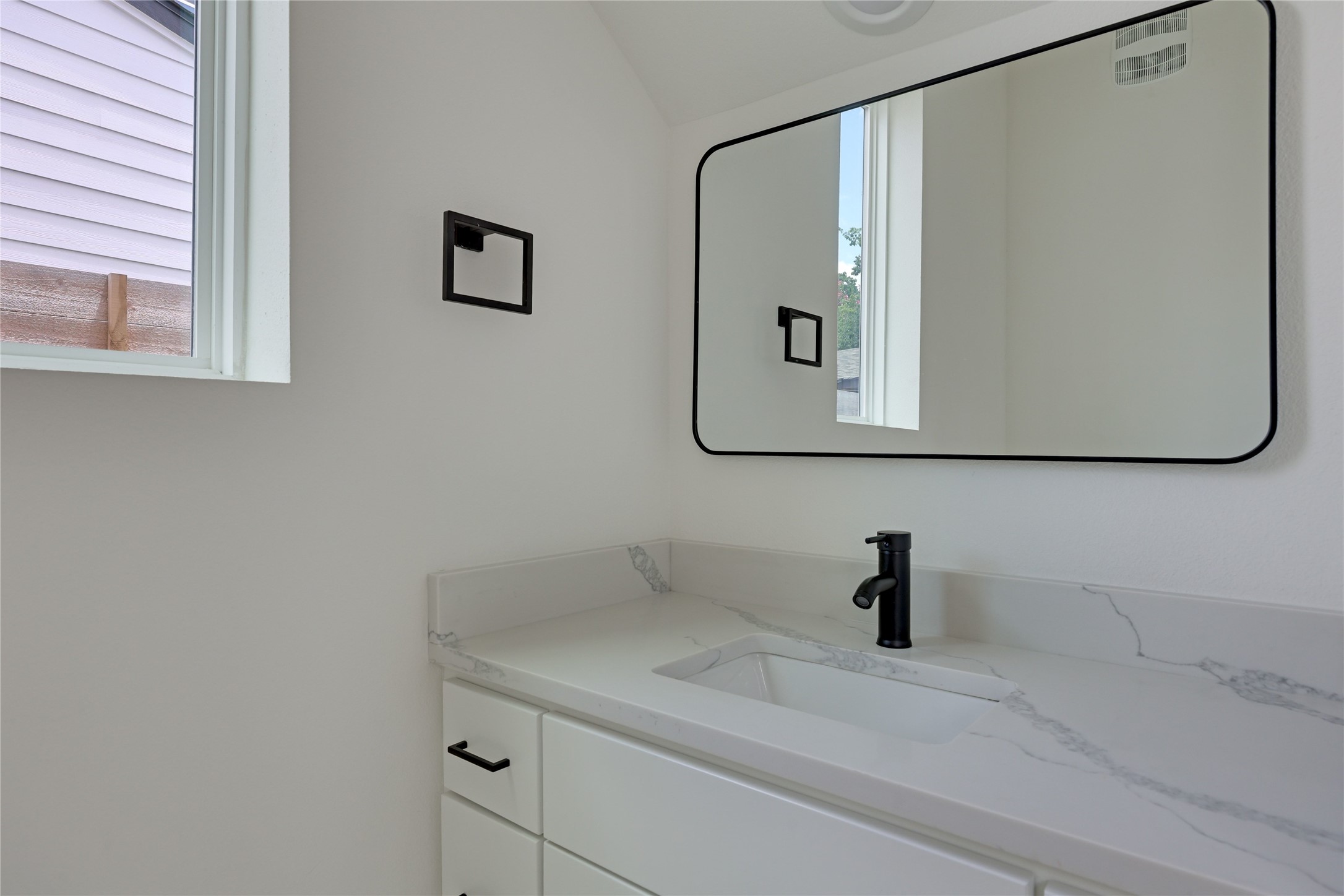 6809 Porter Street, Unit 2 Austin, TX 78741 - Photo 26 of 37 Powder bath located on the main floor.