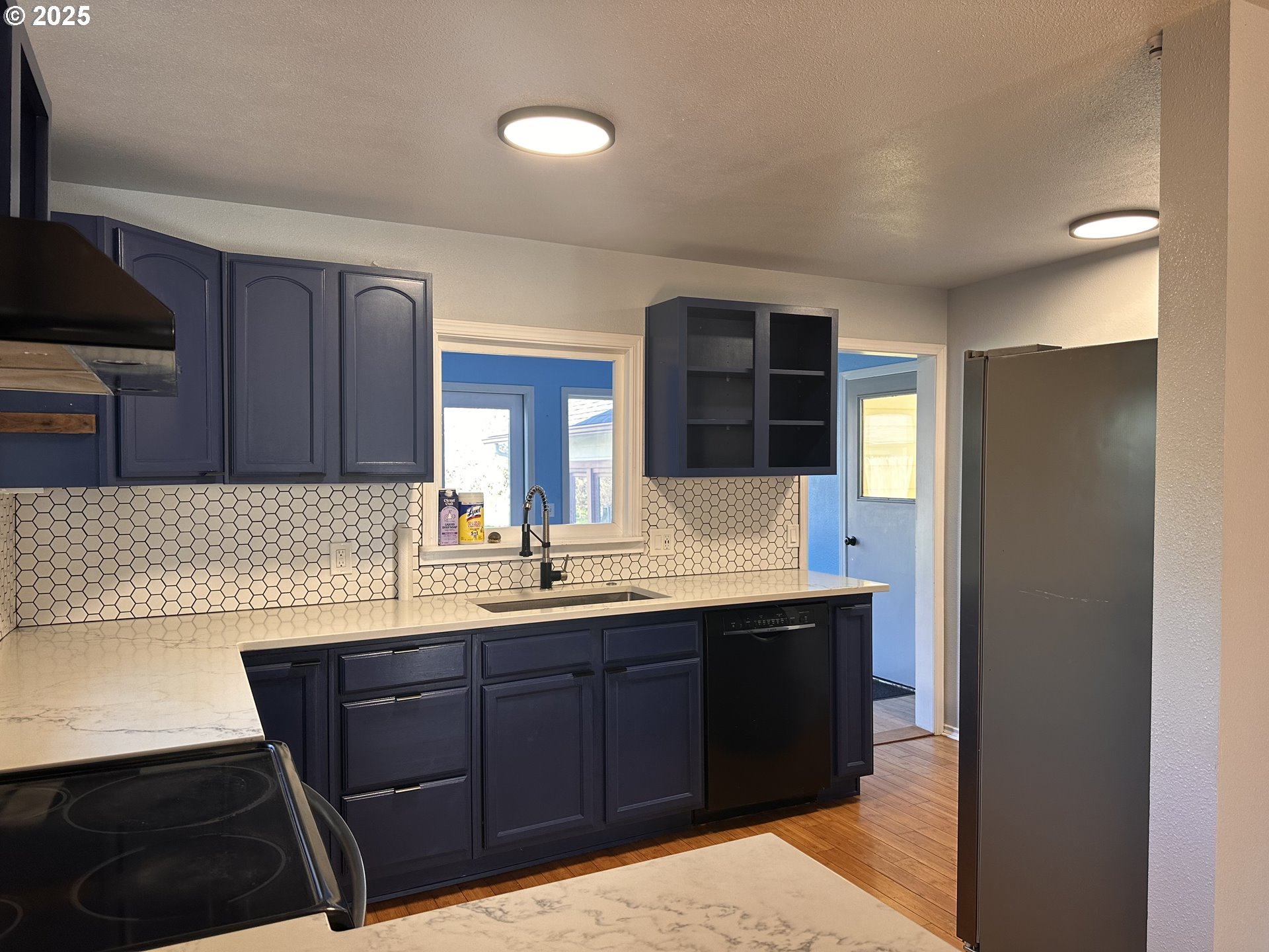 1335 7th Street Florence, OR 97439 - Photo 12 of 39 a kitchen with a sink and a refrigerator
