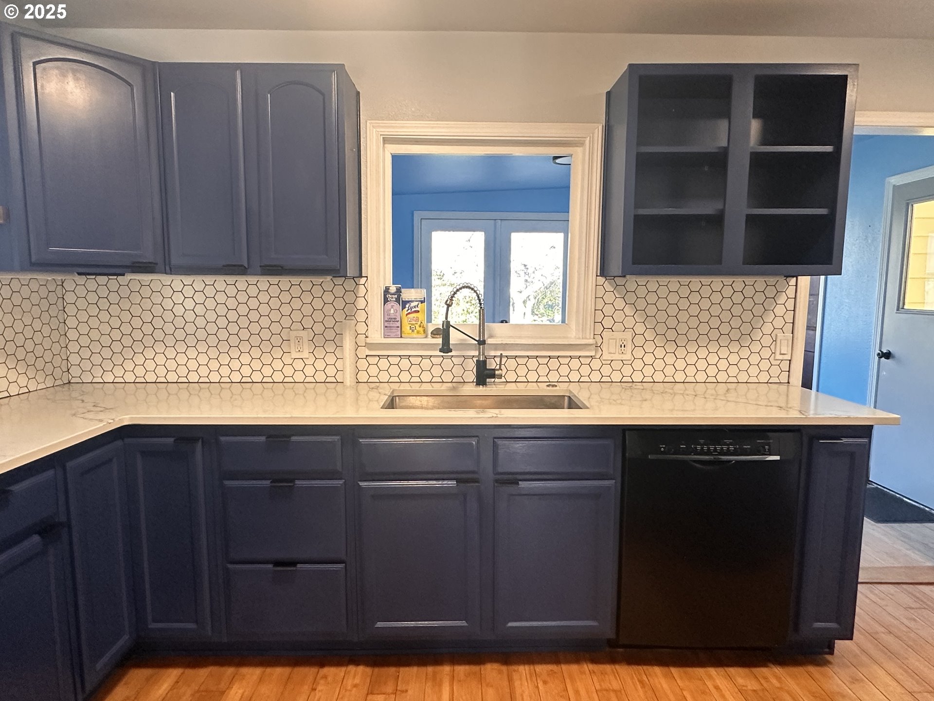 1335 7th Street Florence, OR 97439 - Photo 18 of 39 a kitchen with a sink and cabinets
