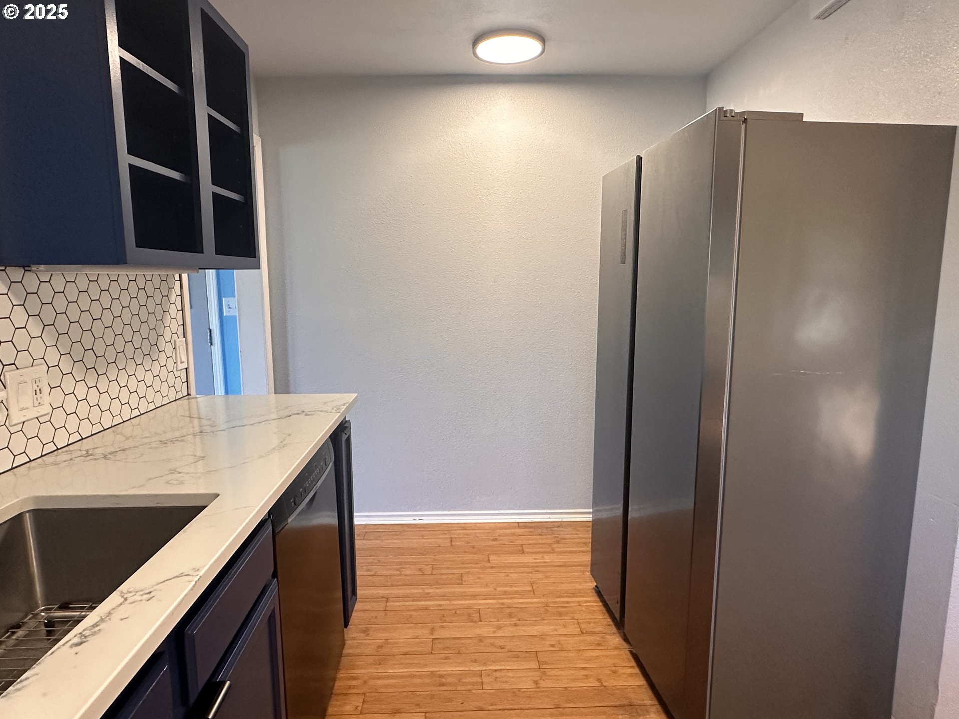 1335 7th Street Florence, OR 97439 - Photo 19 of 39 a kitchen with a refrigerator and a stove