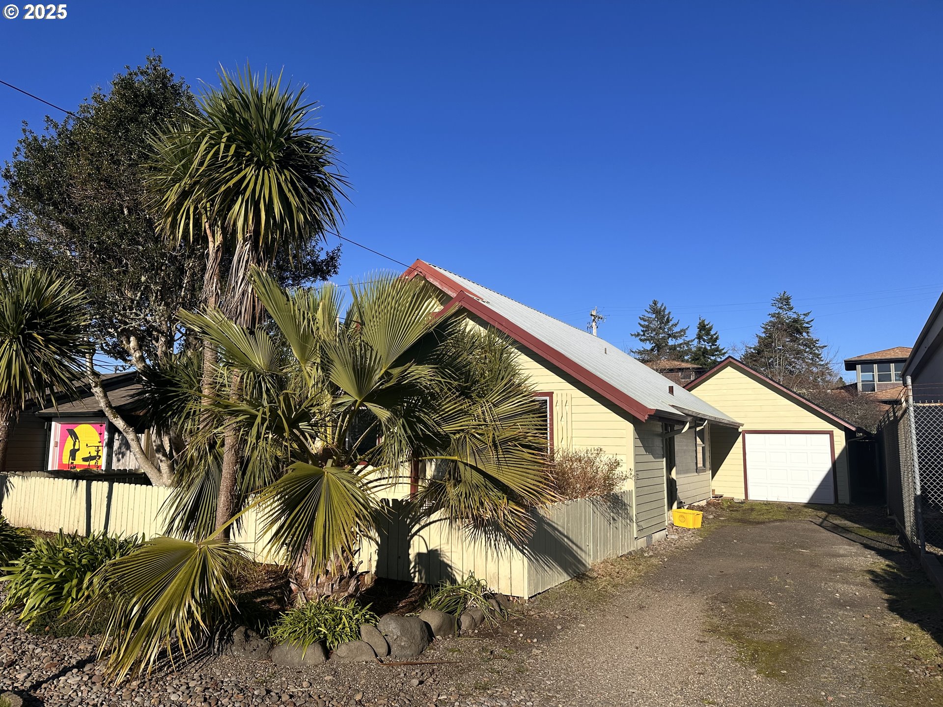 1335 7th Street Florence, OR 97439 - Photo 2 of 39 a view of a house with a palm tree
