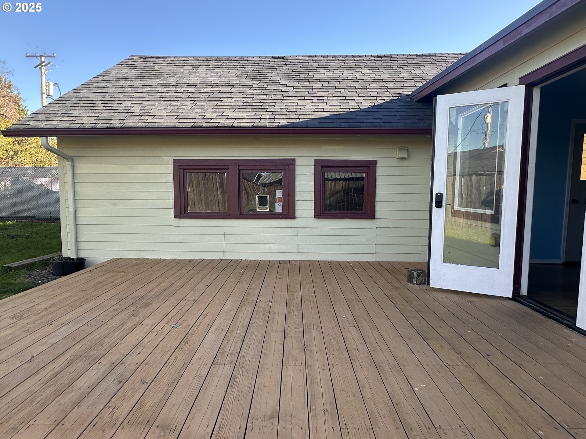 1335 7th Street Florence, OR 97439 - Photo 24 of 39 a view of a house with a wooden deck