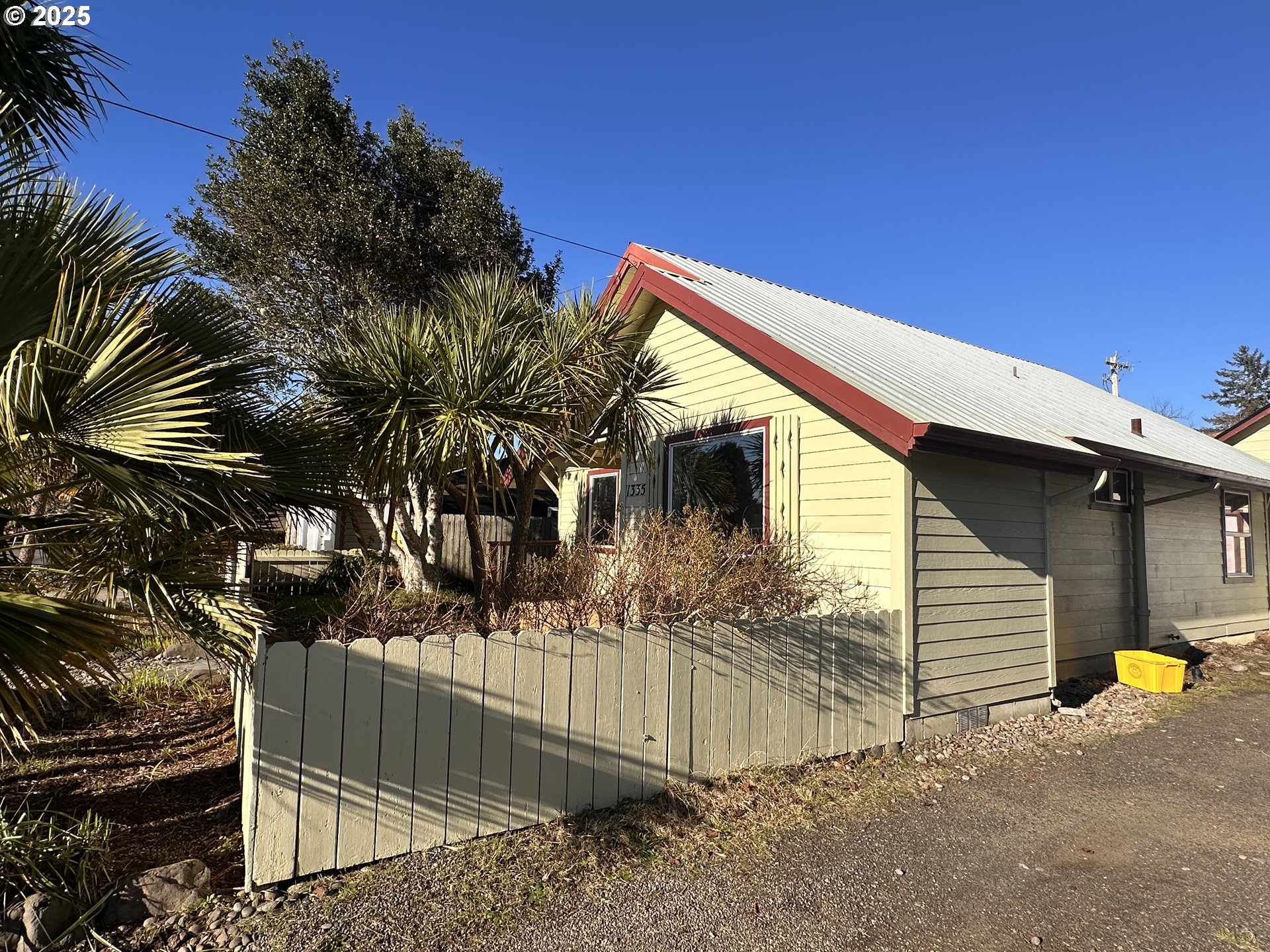 1335 7th Street Florence, OR 97439 - Photo 38 of 39 a view of a house with wooden fence