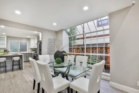 a dining room with furniture and window
