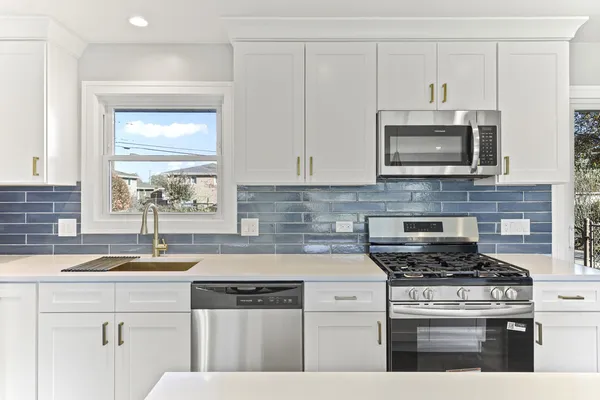 a kitchen with refrigerator and window