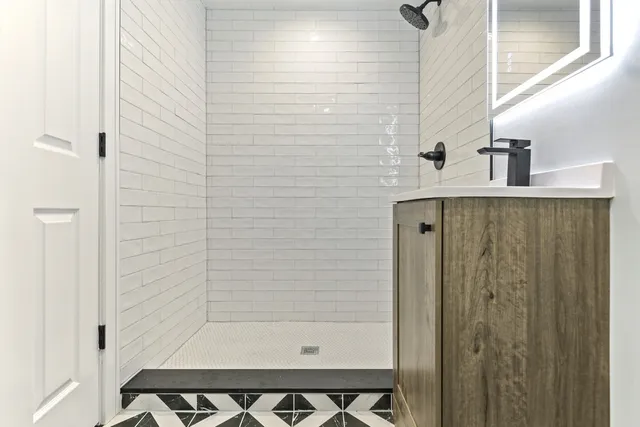 a bathroom with a sink toilet and shower