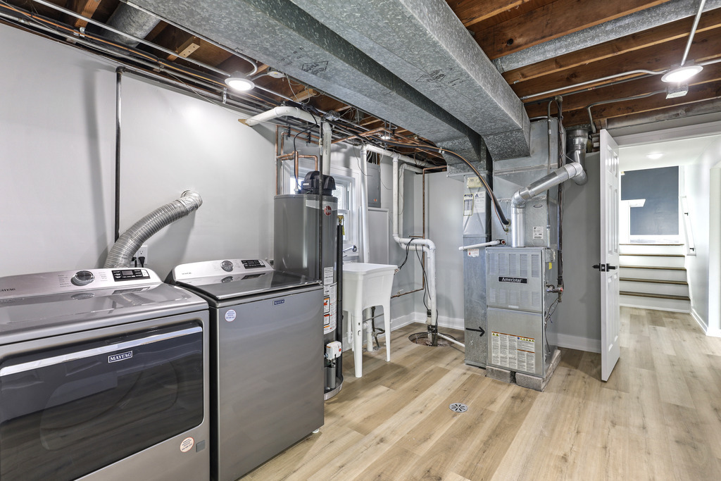 8409 Newland Avenue Burbank, IL 60459 - Photo 30 of 32 a view of a kitchen with a refrigerator and wooden floor