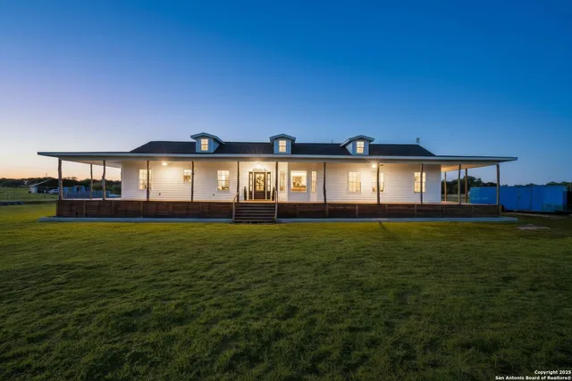 a front view of house with outdoor space and garden