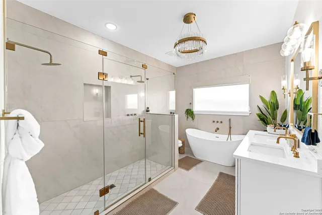 a spacious bathroom with a shower sink and mirror