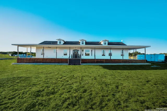 a view of a house with a big yard