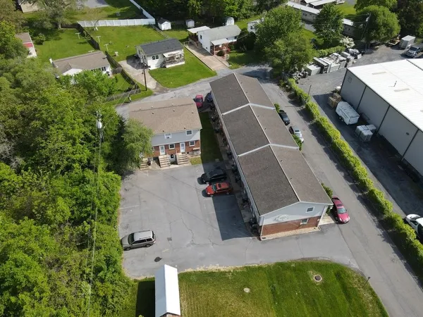 an aerial view of a house with a yard