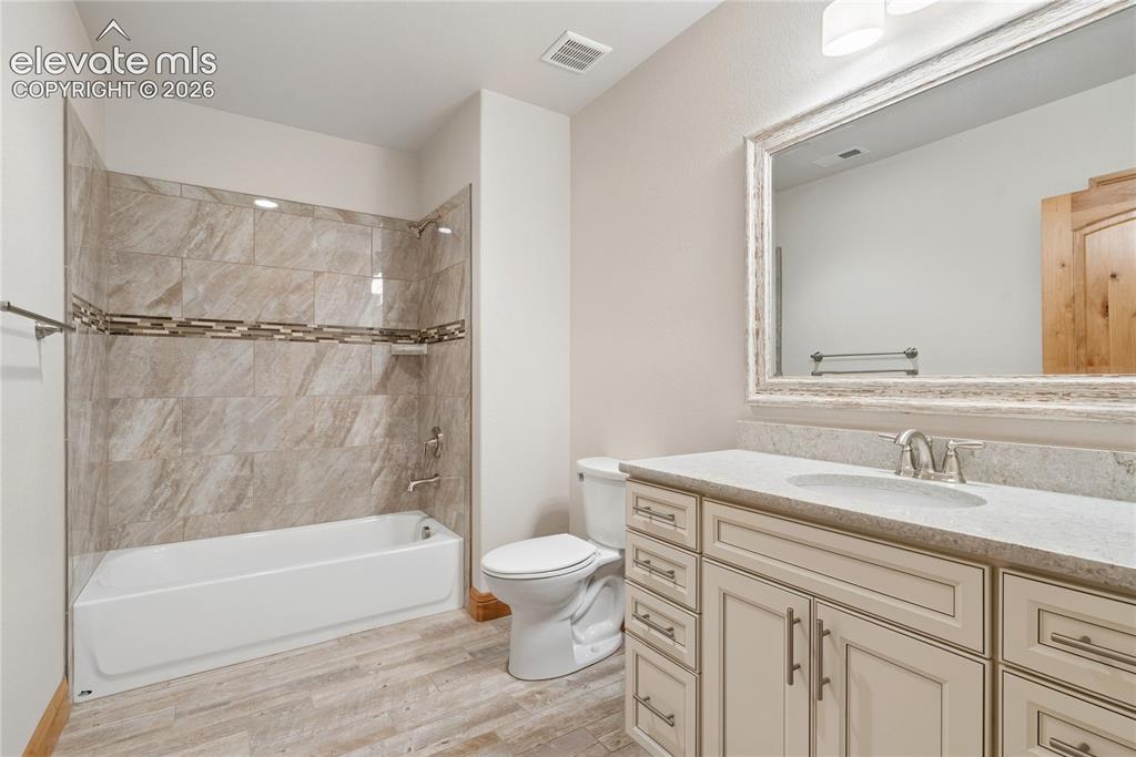 10840 Vollmer Road Colorado Springs, CO 80908 - Photo 38 of 49 a bathroom with a sink a toilet and a bathtub