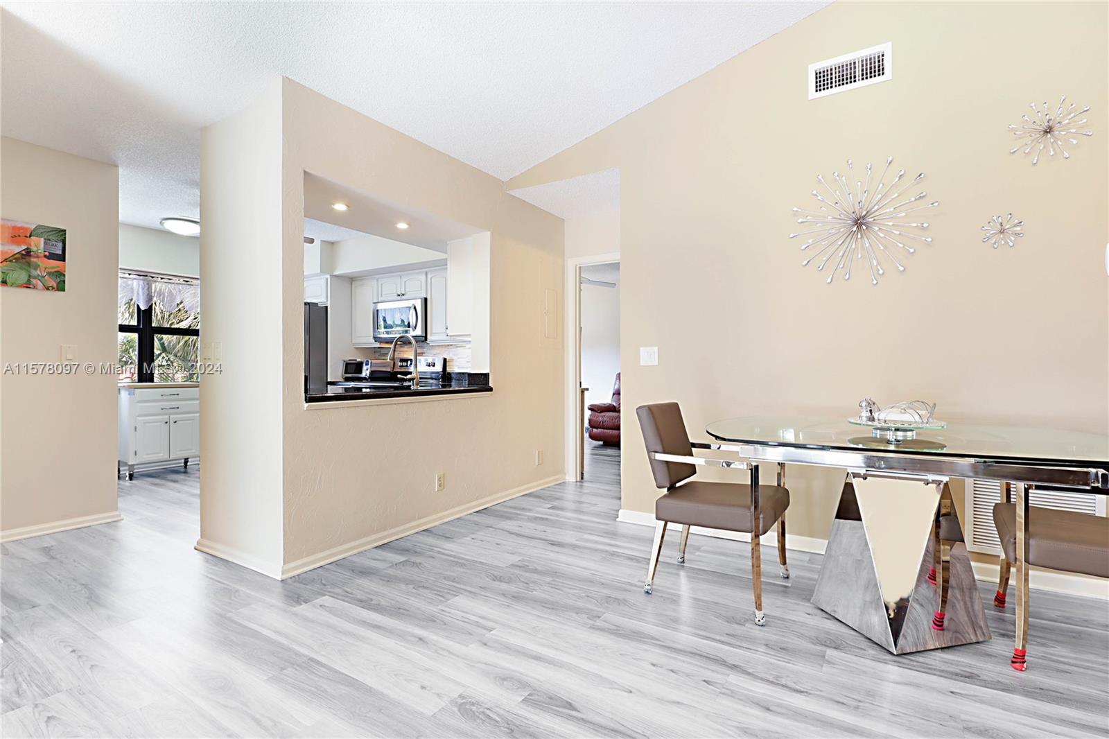 7864 Granada Place, Unit 504 Boca Raton, FL 33433 - Photo 14 of 65 a living room with furniture and wooden floor