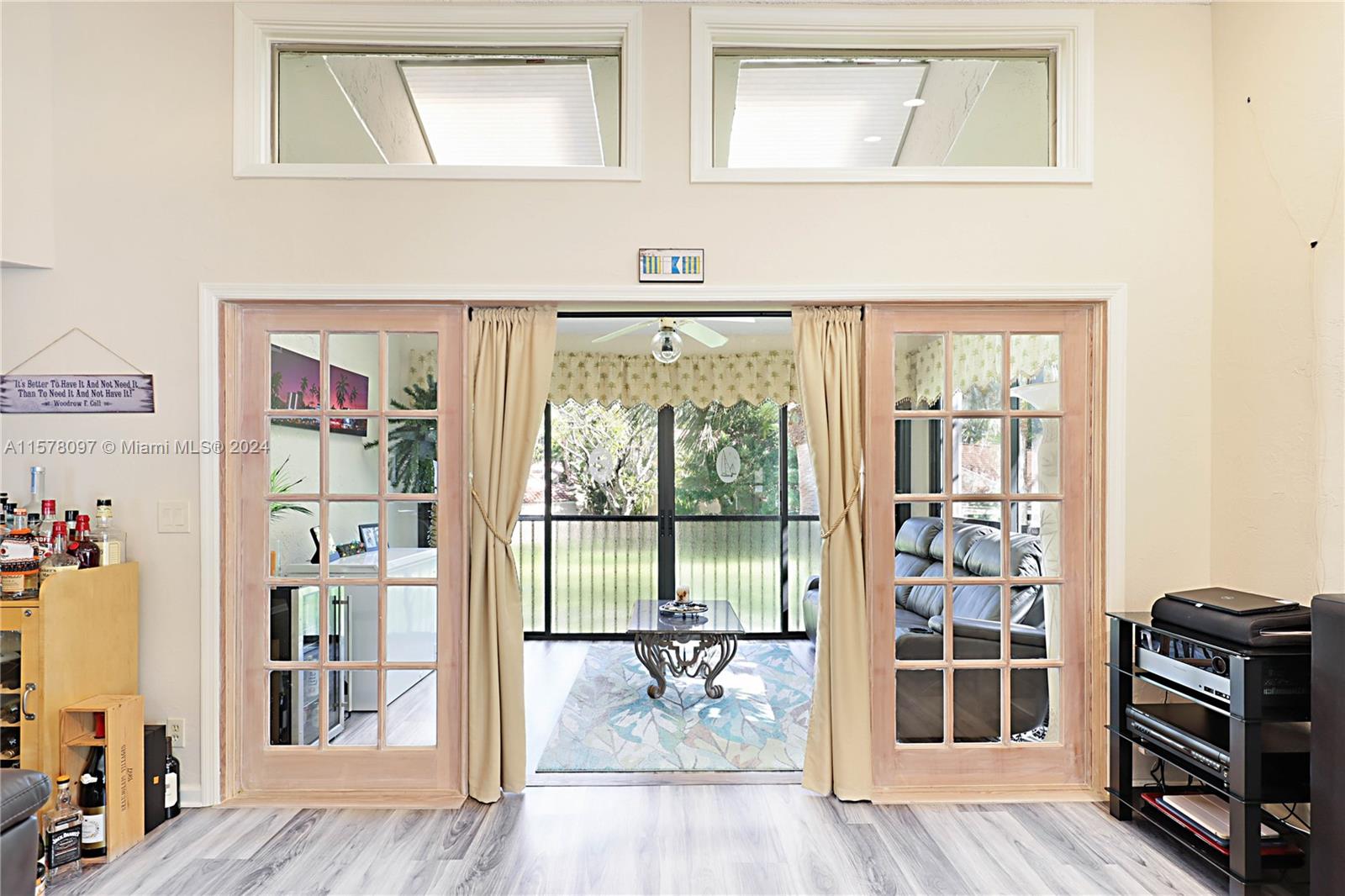 7864 Granada Place, Unit 504 Boca Raton, FL 33433 - Photo 26 of 65 a view of a hallway with wooden floor and dining room
