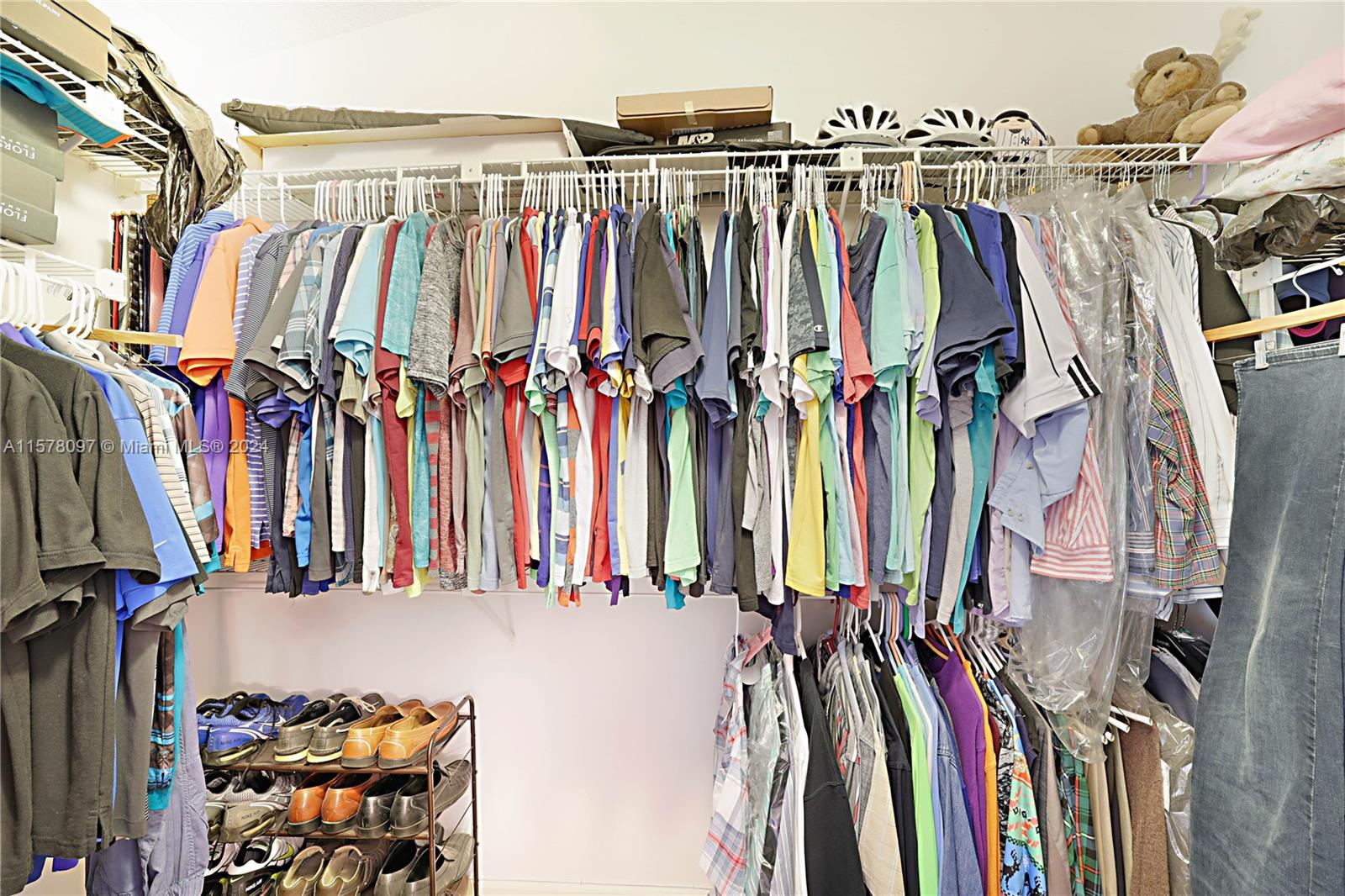 7864 Granada Place, Unit 504 Boca Raton, FL 33433 - Photo 33 of 65 a view of walk in closet with clothes