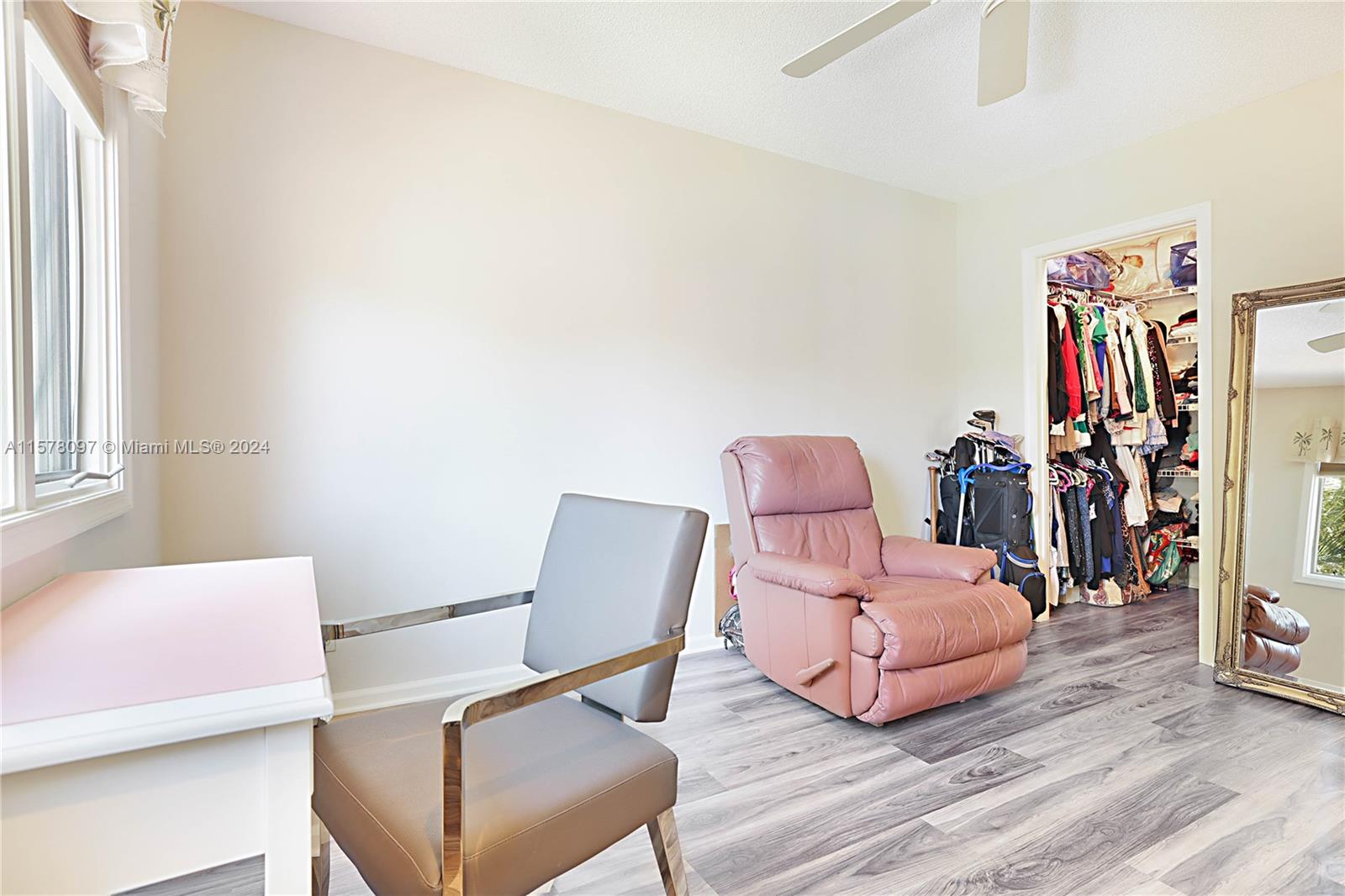 7864 Granada Place, Unit 504 Boca Raton, FL 33433 - Photo 37 of 65 a living room with furniture and a window