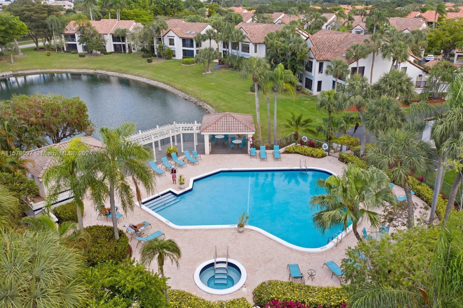 7864 Granada Place, Unit 504 Boca Raton, FL 33433 - Photo 50 of 65 an aerial view of a house with swimming pool and outdoor space