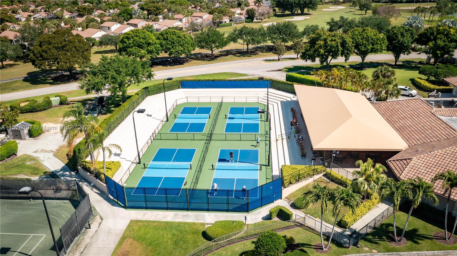 7864 Granada Place, Unit 504 Boca Raton, FL 33433 - Photo 58 of 65 a aerial view of a house with swimming pool and lake view