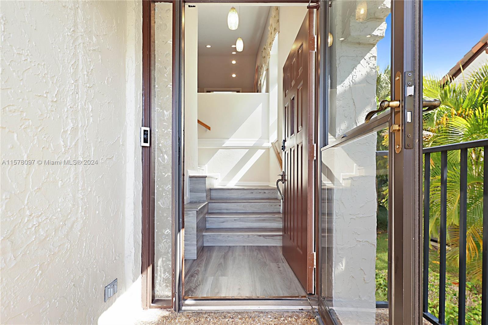 7864 Granada Place, Unit 504 Boca Raton, FL 33433 - Photo 6 of 65 a view of entryway and hall with wooden floor