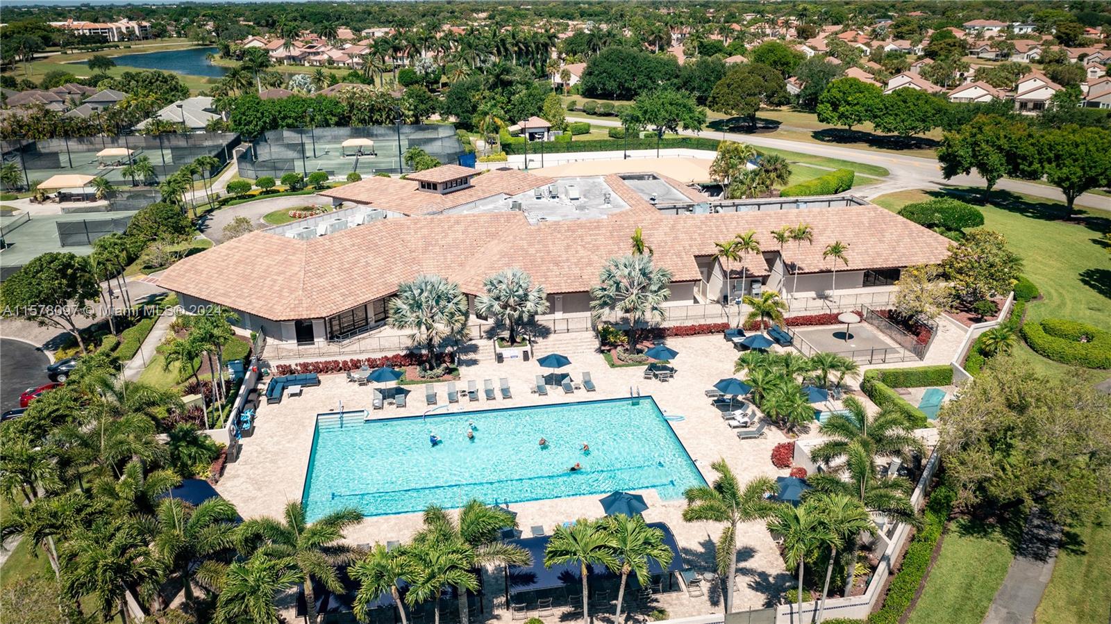 7864 Granada Place, Unit 504 Boca Raton, FL 33433 - Photo 62 of 65 an aerial view of residential houses with outdoor space and swimming pool