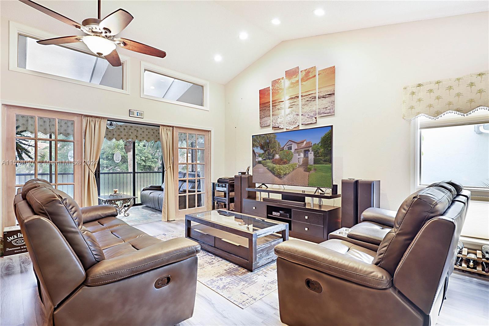 7864 Granada Place, Unit 504 Boca Raton, FL 33433 - Photo 9 of 65 a living room with furniture and a flat screen tv