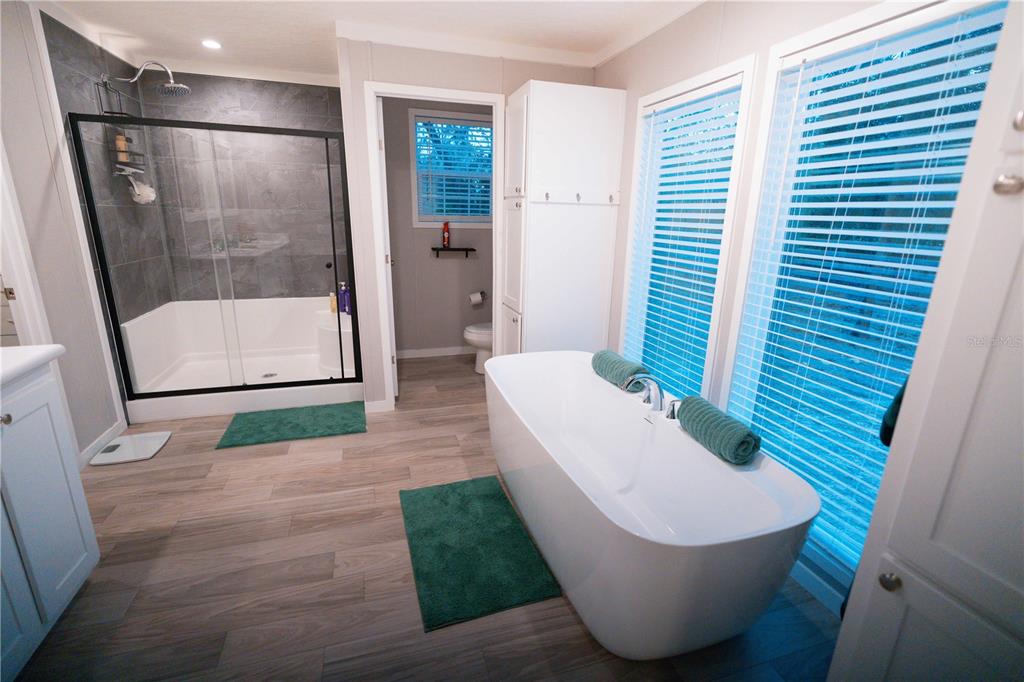 7670 Northeast 97th Court Bronson, FL 32621 - Photo 11 of 58 a bathroom with a sink and a mirror