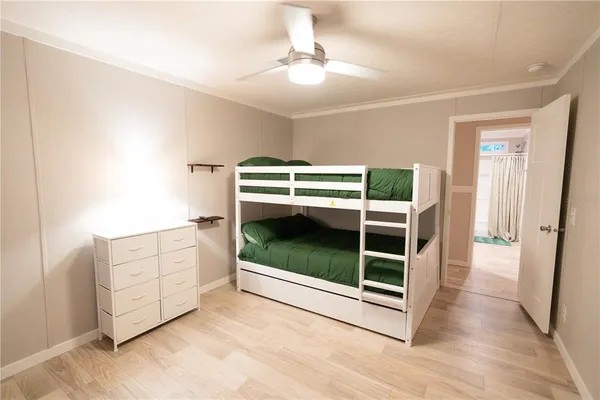 a view of an empty room with cabinet and fire place