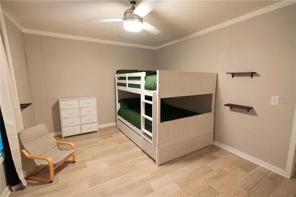 a living room with a couch and a flat tv screen