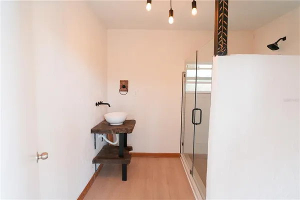 a view of a house with a yard and tree