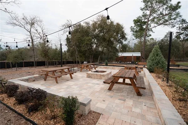 a view of swimming pool with outdoor seating