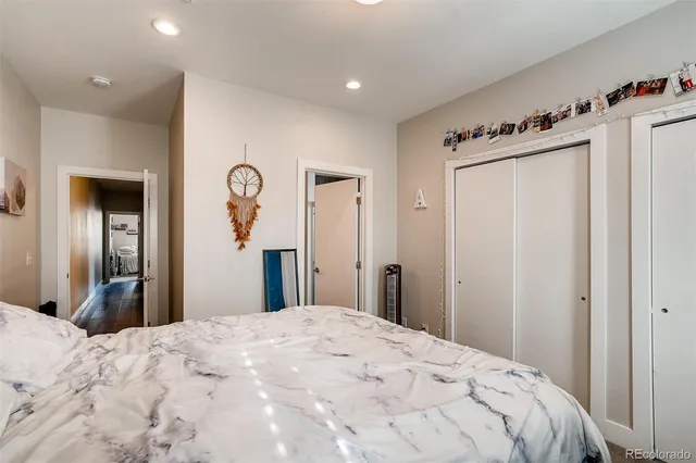 a bedroom with a bed and a mirror